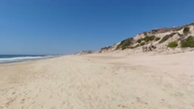 LOS CABOS MEXICO-2020: Footage Of A Beach With A Clear Blue Sky And A Small Hill