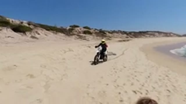 LOS CABOS MEXICO-2020: A Motocross Athlete Riding On His Bike By The Sea On A