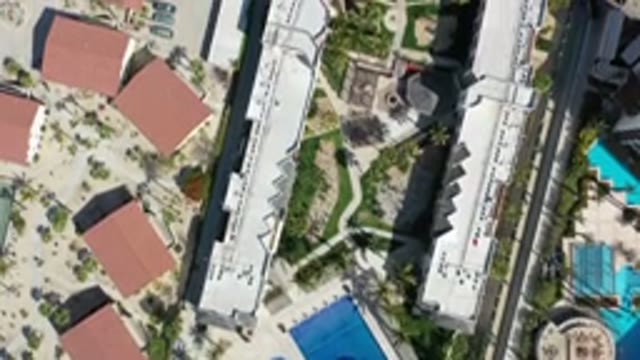 LOS CABOS MEXICO-2020: Bird's Eye View Pan Over A Residential Area Near Large Buildings