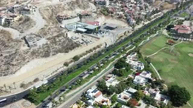 LOS CABOS MEXICO-2020: Top View of Dry Area and Green Village Near Highway