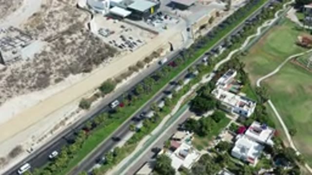 LOS CABOS MEXICO-2020: Aerial View Of Traffic On The Highway Past Buildings