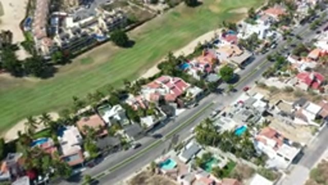 LOS CABOS MEXICO-2020: City With Buildings Houses Pools And Trees