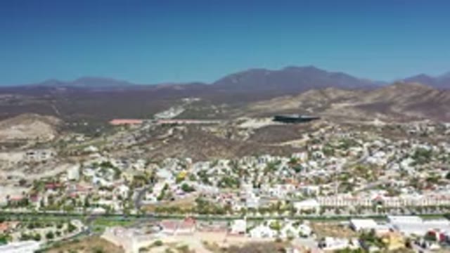 LOS CABOS MEXICO-2020: View Of Buildings In A City With Mountains In The
