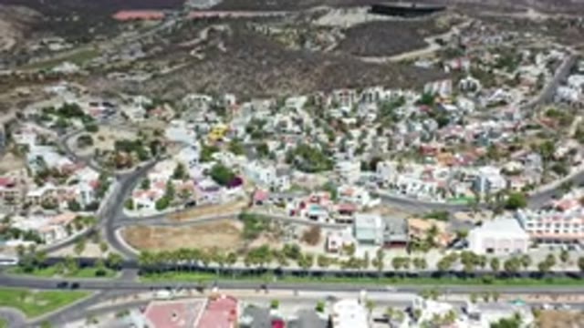 LOS CABOS MEXICO-2020: Cars Traveling On Busy Road Next To A Beautiful Resort