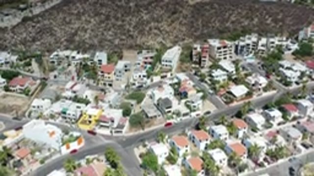 LOS CABOS MEXICO-2020: Countryside Leading Into A Sprawling Suburban Town Filled