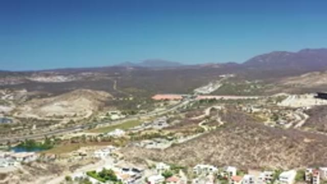 LOS CABOS MEXICO-2020: Aerial Pan Of Landscape Including Small Town And Large