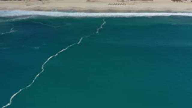 LOS CABOS MEXICO-2020: The Blue Waters Of The Sea Against The Sandy Beach Looks