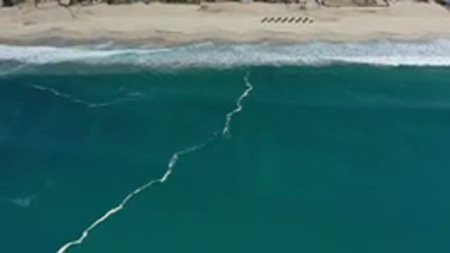LOS CABOS MEXICO-2020: Sea Green Ocean Waves Zooming Toward Sandy Beach