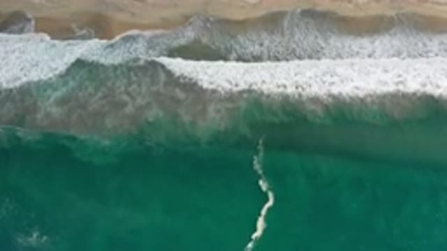 LOS CABOS MEXICO-2020: Large Crashing Ocean Waves Washing Over Sandy Beach