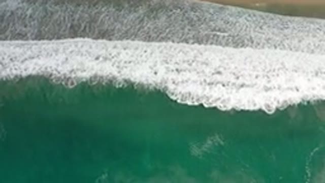LOS CABOS MEXICO-2020: Green Water Beach Sky View With Sand And Foam Bubbles