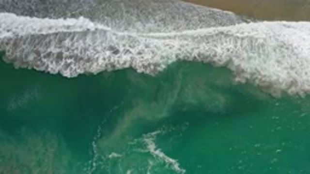 LOS CABOS MEXICO-2020: Aerial View Of White Waves From Teal Ocean Crashing On A