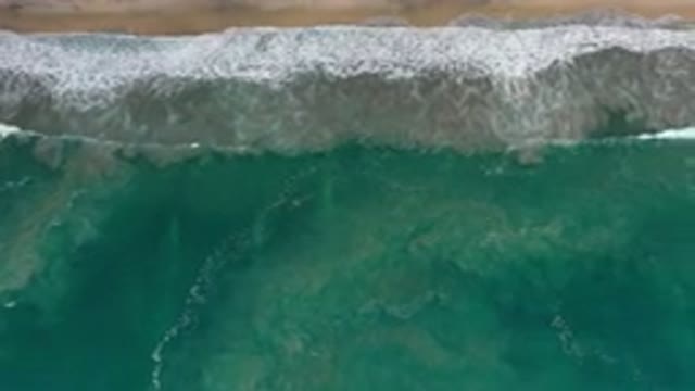 LOS CABOS MEXICO-2020: White Waves From Blue Green Ocean Crash Against Sandy