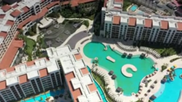 LOS CABOS MEXICO-2020: Drone View Flying Over Hotel And Pool Slowly Zooming In