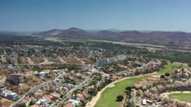 LOS CABOS MEXICO-2020: Footage Of A City With Green Grass Fields Next To Mountains