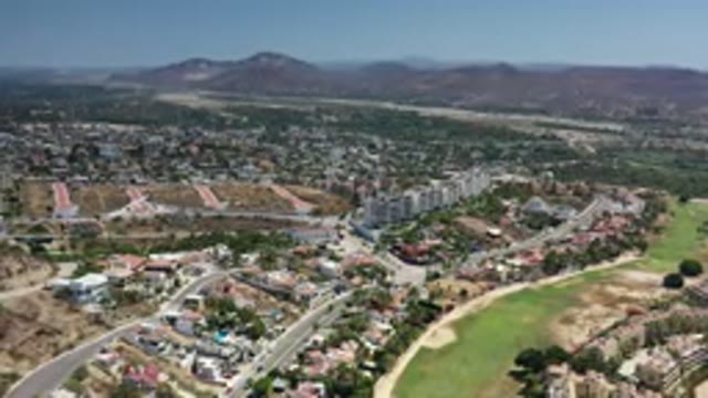 LOS CABOS MEXICO-2020: Footage Of A City Next To Mountains And Grass Fields With