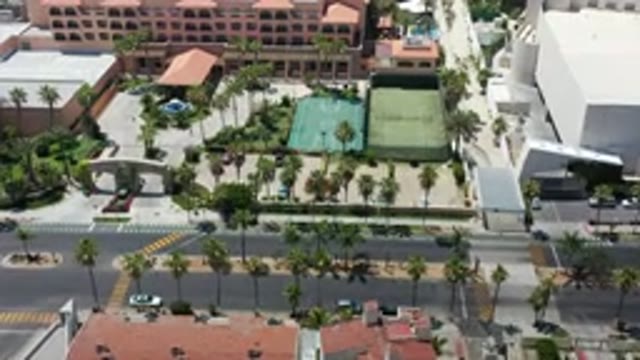 LOS CABOS MEXICO-2020: Aerial View Of A City With Lots Of Trees And Roundabouts