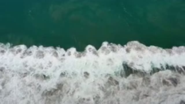 LOS CABOS MEXICO-2020: Green and White Waves Moving in Ocean and Showing
