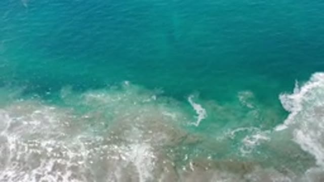 LOS CABOS MEXICO-2020: Slow Waves In Translucent Sea Close To Shore