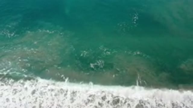 LOS CABOS MEXICO-2020: Sparkling Green Ocean Water With White Capped Waves