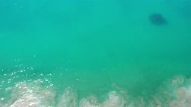 LOS CABOS MEXICO-2020: Panning Shot Of The Shimmering Ocean Surface Showing A