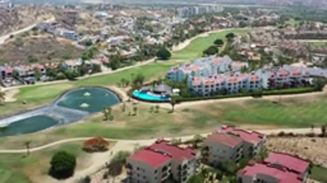 LOS CABOS MEXICO-2020: Aerial View Of Buildings Lake And A Pool With Roads And