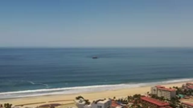 LOS CABOS MEXICO-2020: A Ship In The Middle Of The Ocean Next To A Beach And