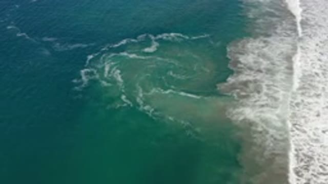 LOS CABOS MEXICO-2020: Blues And White Waves Wash Against Beach In Tropical