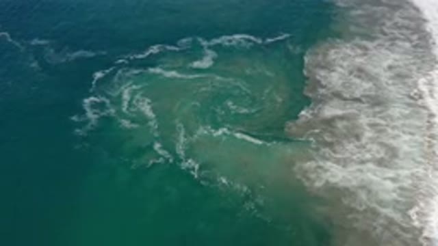 LOS CABOS MEXICO-2020: Beautiful Circular Shape In The Ocean From Waves Mixing