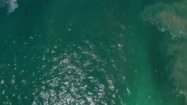 LOS CABOS MEXICO-2020: An Aerial View Of Green Water With Current Ripples As It Moves