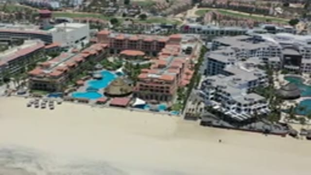 LOS CABOS MEXICO-2020: Gray Roofed Resort And Red Roofed Resort Both With Pools