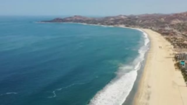 LOS CABOS MEXICO-2020: Footage Of A Beach With Small Waves And Next To A City