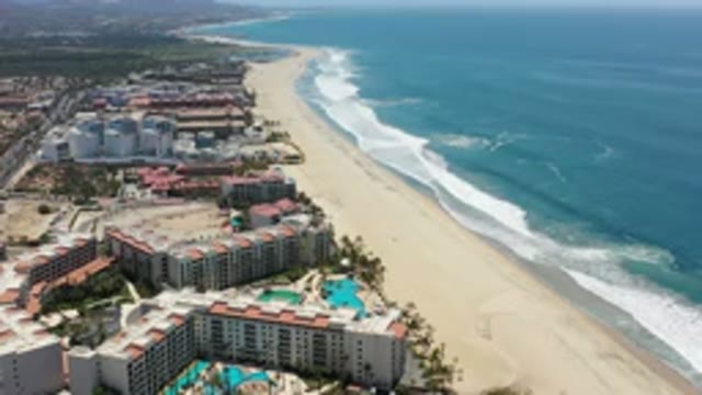 LOS CABOS MEXICO-2020: Beautiful Blue Sea Advances On The Sand Of The Coastal