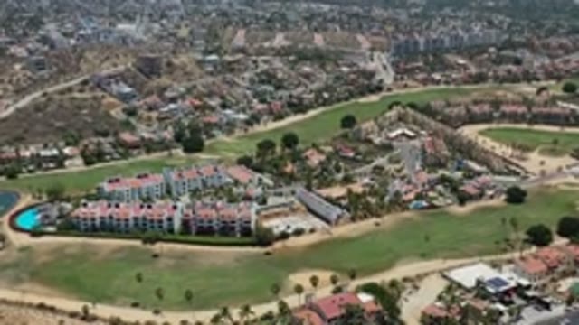 LOS CABOS MEXICO-2020: City Next To Green Grass Fields With Luxury Homes And Pools