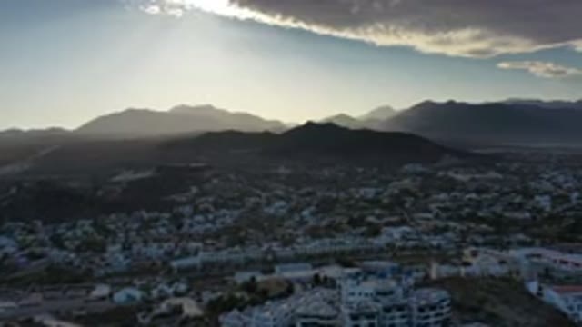 LOS CABOS MEXICO-2020: White Homes In Mountain View With Sun Peaking Through The