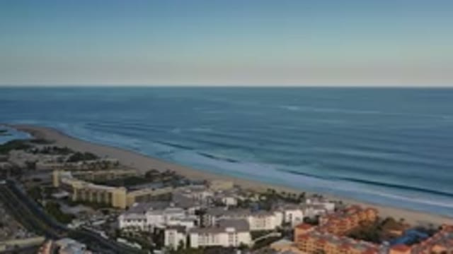 LOS CABOS MEXICO-2020: Aerial View Of A City With Lots Of Trees And A Blue Sky