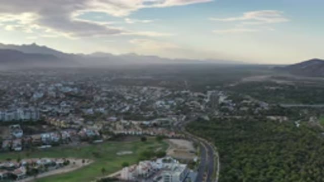 LOS CABOS MEXICO-2020: A Highway Runs Through An Urban Area That Sprawls Across