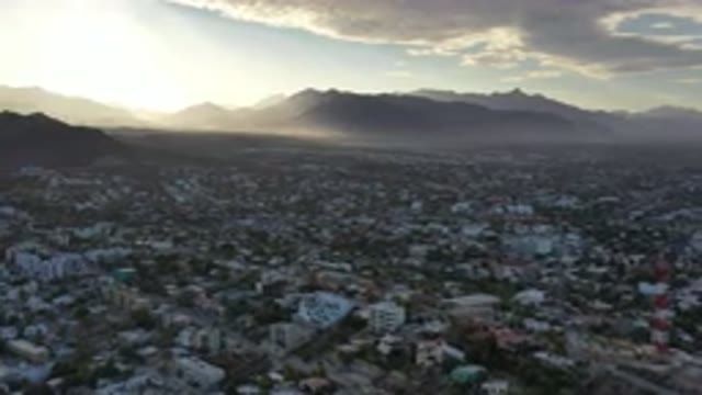 LOS CABOS MEXICO-2020: Showing Footage Of A City From The Sky With Mountains In
