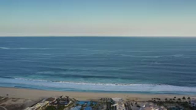 LOS CABOS MEXICO-2020: Clear Sky Above An Endless Sea With Waves Crashing