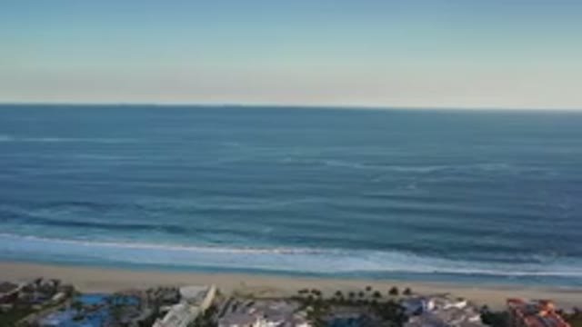LOS CABOS MEXICO-2020: Panning Right On A Beach With Beautiful Deep Blue Waves