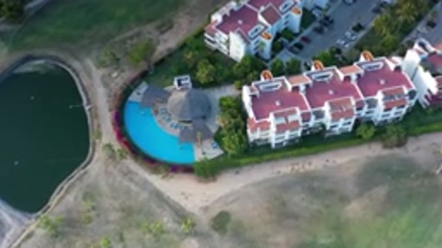 LOS CABOS MEXICO-2020: Aerial View Of Red Rooftop Buildings With Blue Pool And