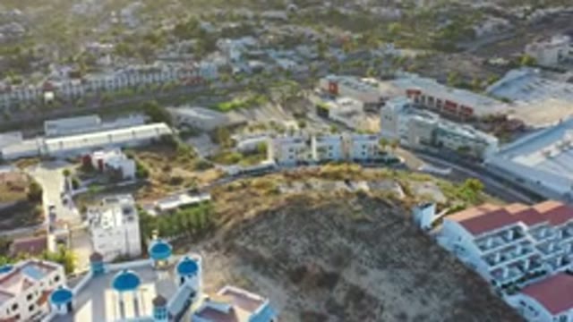 LOS CABOS MEXICO-2020: View Of Tall Buildings On The Side Of A Large Hill