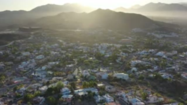 LOS CABOS MEXICO-2020: Top View Of The City Among The Mountains Lit By The