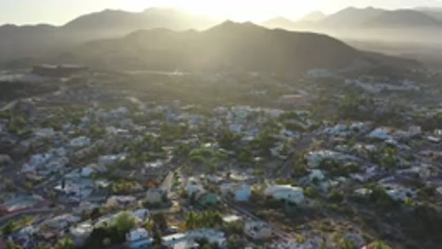LOS CABOS MEXICO-2020: Crowded Town With Buildings Around A Mountain With A Lot