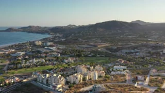 LOS CABOS MEXICO-2020: Aerial View Of Seaside Town With Mountains In The Background