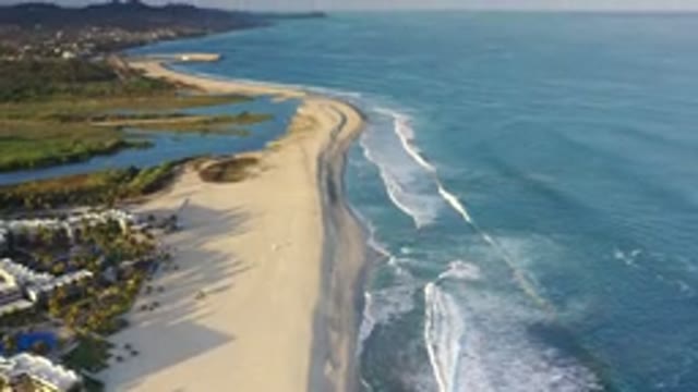 LOS CABOS MEXICO-2020: Waves Crashing Into The Beach With Beautiful Mountains