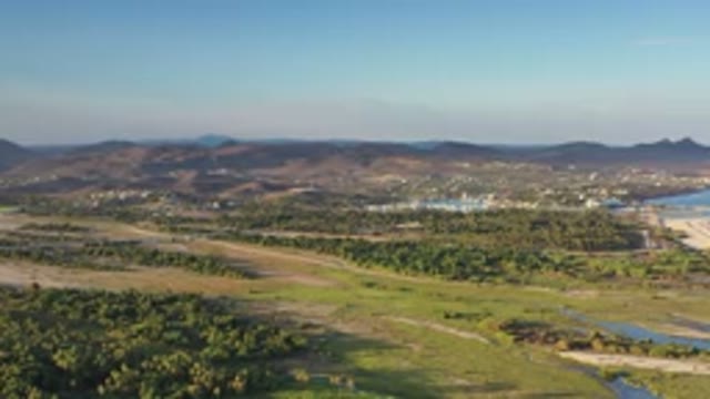 LOS CABOS MEXICO-2020: Clear Blue Sky Over Mountains And Green Space With Many
