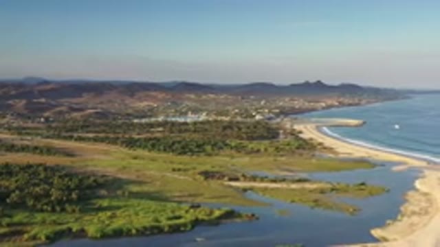 LOS CABOS MEXICO-2020: Aerial View Of A Coastline With A Lagoon And Mountains