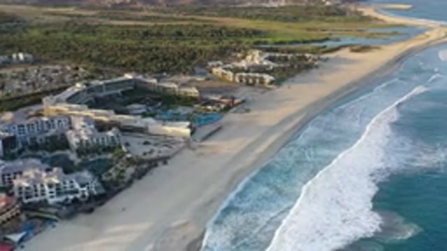 LOS CABOS MEXICO-2020: Aerial Footage of Rolling Blue Waves Crashing Against White Sand