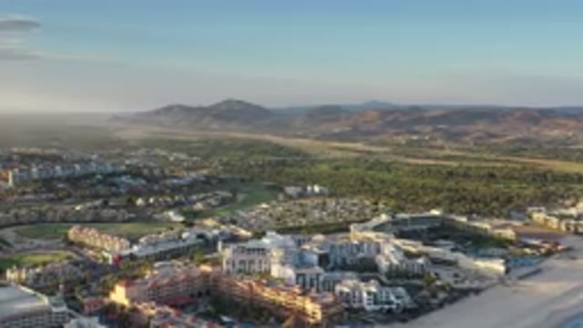 LOS CABOS MEXICO-2020: Drone View Of A Beautiful City With Green Mountains And