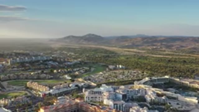 LOS CABOS MEXICO-2020: Aerial View Of City With Sunset And Mountains